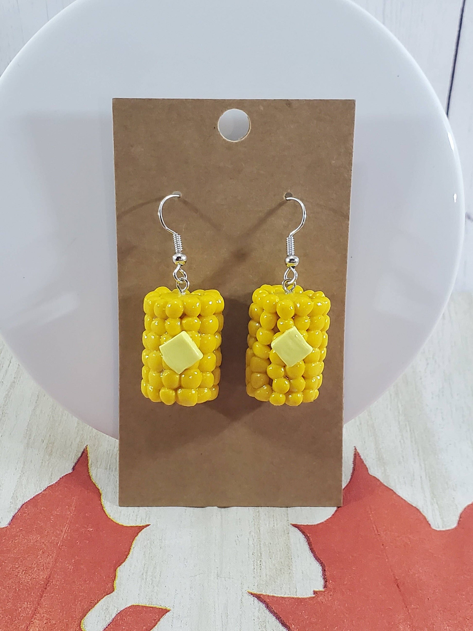 realistic buttered corn on the cob earrings on earring card