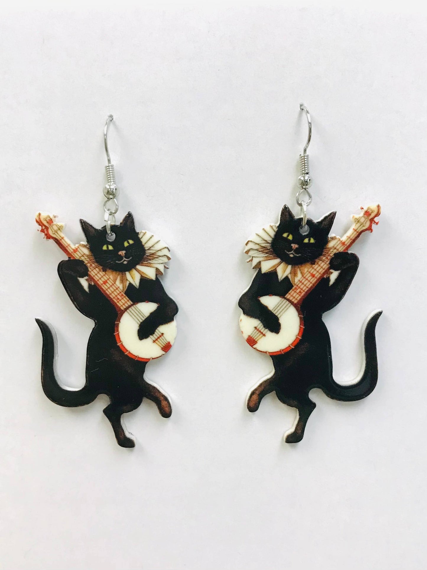 black cat holding a banjo earrings